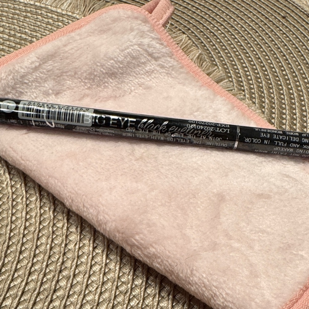 Black Eyeliner with Pink Makeup Cloth